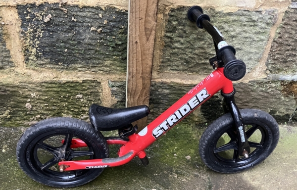 Strider balance bike, red