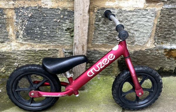 Cruzee alloy balance bike, pale red